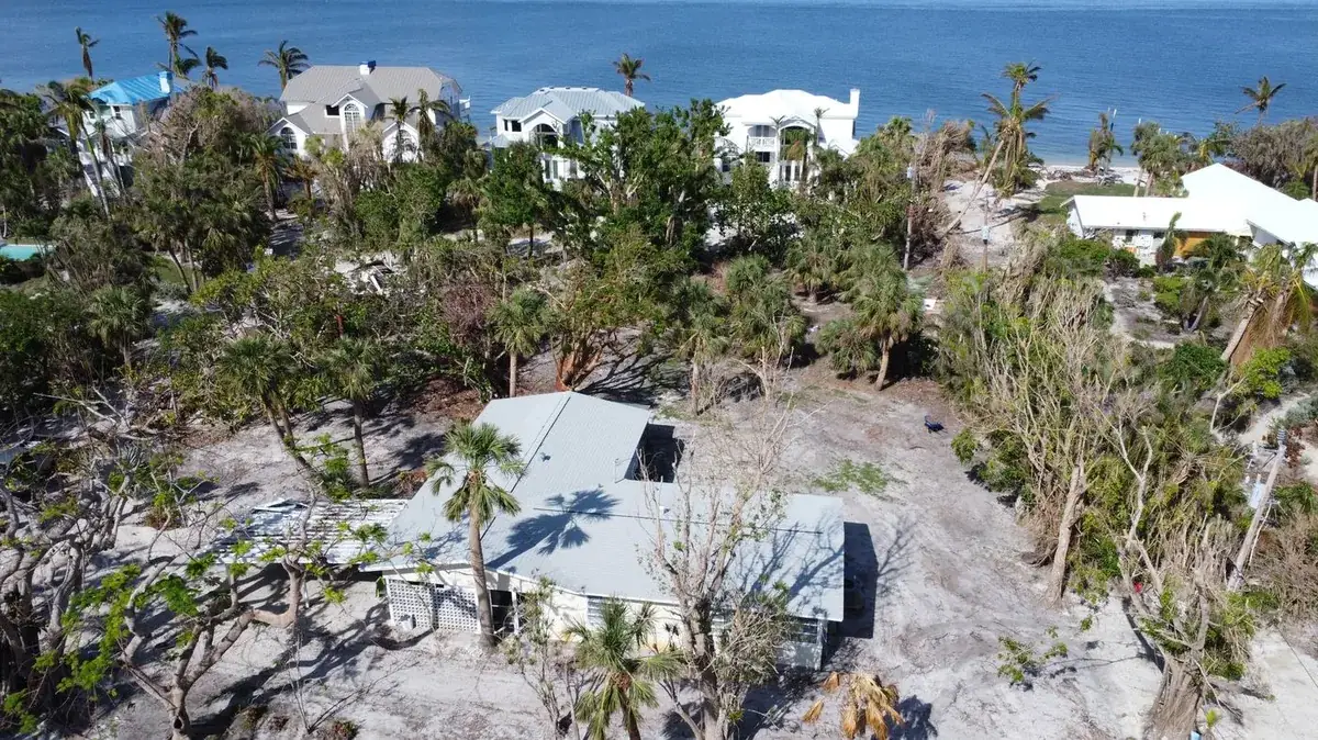 After the hurricane on Sanibel — the island stripped bare, the Blue Dog roof untouched