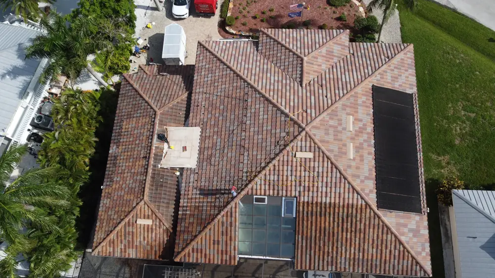 Aerial view of a new tile roof on a Southwest Florida pool home